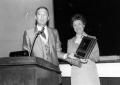 Photograph: [Dr. Robert Cloud, President of Lee College presents Gladys O'Brien w…