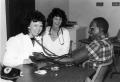 Primary view of [Nursing students Susan Whiteneck and Beth Kohlmeyer check blood pressure of Houston Lewis.]