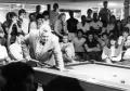 Photograph: Jack White, pro billiards player demonstrating his technique to stude…