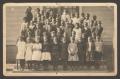 Primary view of [Postcard of African American Children on School Steps]