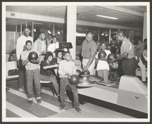 Primary view of object titled '[Boys Bowling at Carver Plaza]'.