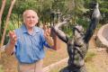 Primary view of [Charles Umlauf Standing Next to a Sculpture]