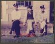 Photograph: [Three Men Sitting Outside Fire Station No. 7]