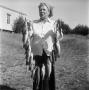 Photograph: [Woman Holding a String of Fish]