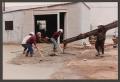 Photograph: [Construction Workers Spreading Cement #3]