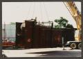 Photograph: [Boiler Being Lifted By Crane at Dr. Pepper Museum]