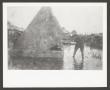 Photograph: [Soldier With Tent in Water]