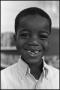 Photograph: [Boy Smiles Missing Front Teeth]