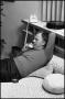 Photograph: [Paul Eggers Relaxing in Bed, Talking on the Phone]