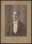 Photograph: [Photograph of a Man Wearing a Light Bow Tie]