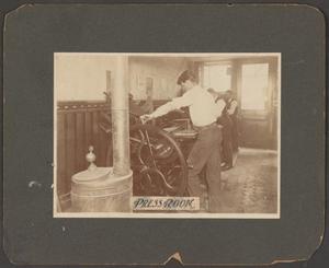Primary view of object titled '[Photograph of an Unknown Man in a Press Room]'.