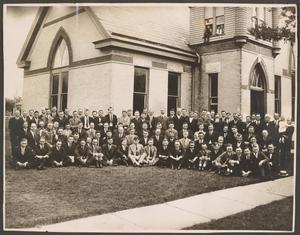 Primary view of object titled '[Photograph of a Group of Men in Front of a Church]'.