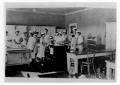 Photograph: [Cooks in a kitchen]