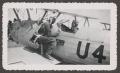 Photograph: [Herman Fuchs and Lila Moore with Biplane]