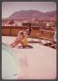 Photograph: [Gayle Snell and Woman by Pool]