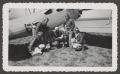 Photograph: [Herman Fuchs with Five WASP Students and Biplane]