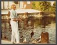 Photograph: [Woman feeding Ducks]