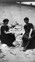 Photograph: [Two Women in Swimsuits Sit on the Beach]