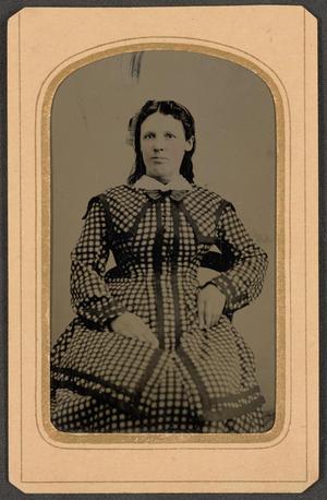 Primary view of [Photograph of Woman Wearing a Checked Dress]