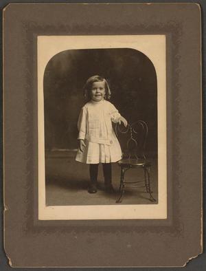 Primary view of object titled '[Photograph of a Child Wearing a Pleated Dress]'.