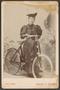 Primary view of [Photograph of Woman With a Bicycle]