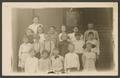 Postcard: [Postcard of Eleanor Wimberly and Class in Front of a Building]