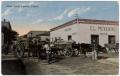 Primary view of [Oxen carts in front of pawn shop]