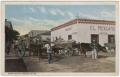 Postcard: [Oxen carts in front of a pawn shop]