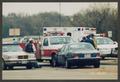 Primary view of [Paramedics, Firefighters, and Police at a Wreck]