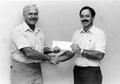 Primary view of [Buddy Shipp presents a $1000 check to David Bourque]