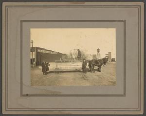 Primary view of object titled '[Men with Lumber in a Street]'.