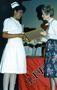Photograph: [Dorla Hill and Lynn Embry at LVN graduation ceremony, 1989]