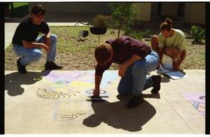 Primary view of object titled '[Individuals creating sidewalk chalk art at PACfest]'.