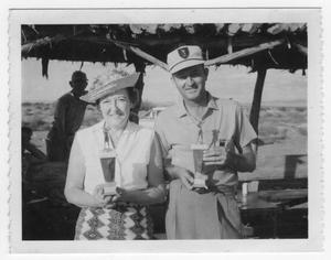 Primary view of object titled 'Audrey Synder and Jack Watts with Golf Trophies'.