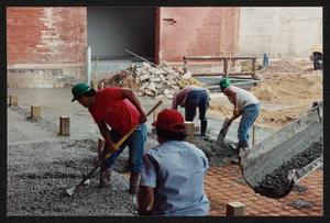 Primary view of object titled '[Construction Workers Spreading Cement #1]'.