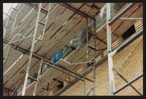 Primary view of object titled '[Photograph from Below Scaffolding at The Dr. Pepper Museum]'.