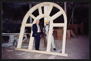 Primary view of object titled '[Wilton Lanning and Joe Cavanaugh Standing in an Arched Window Frame]'.