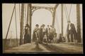 Postcard: [Postcard of a Group on a Railroad Bridge]