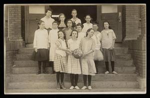 Primary view of object titled '[Postcard of Students Posing with Teacher]'.