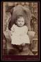 Photograph: [Portrait of an Unidentified Child in a Small Chair]