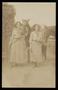 Postcard: [Postcard of Two Women Standing with Horses]