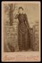 Primary view of [Portrait of an Unidentified Woman Posing with a Gate]