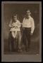 Photograph: [Portrait of Two Children Wearing Bows]