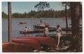 Thumbnail image of item number 1 in: '[Postcard of Young Women Standing by Canoes and Swimming at Camp Fern near Marshall, Texas]'.