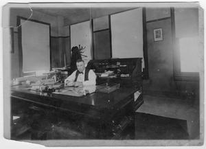 Primary view of object titled '[Col. Hugh B. Moore in his office in 1915]'.