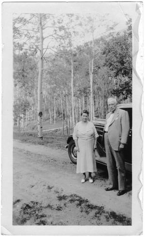 Primary view of object titled '[Col. Hugh B. and Helen Moore standing on a road near Santa Fe, New Mexico]'.