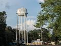 Thumbnail image of item number 1 in: '[Water Tower and Dr. Mud's Liquor in Sour Lake, TX]'.