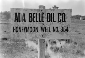 Primary view of object titled '[Ada Belle Oil Company Sign]'.
