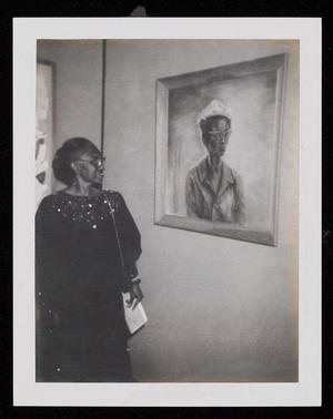 Primary view of object titled '[A Woman Looking at a Portrait]'.