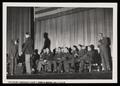 Photograph: [Soldiers on Stage During Ordnance Plant Visit]